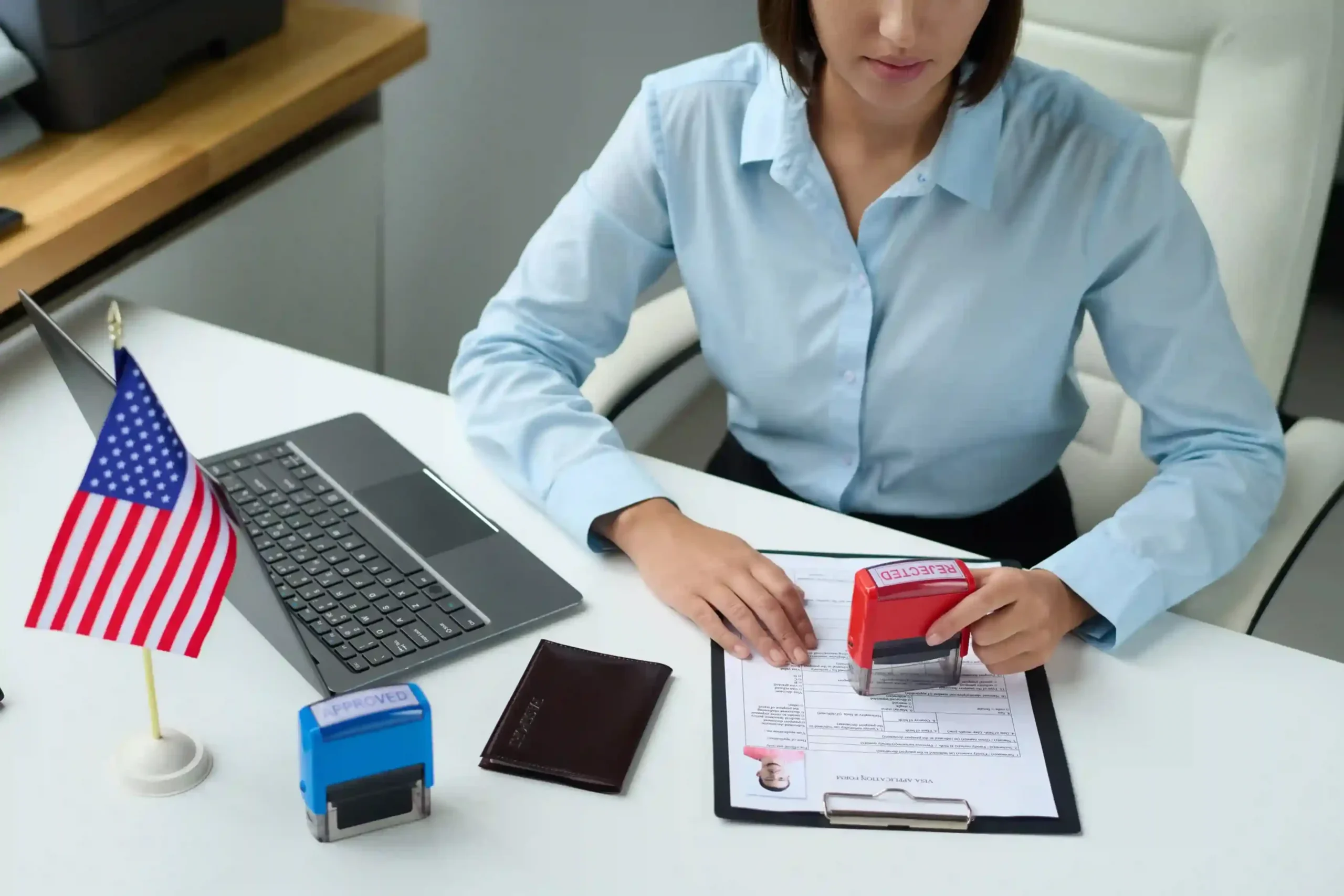 high-angle-view-professional-specialist-rejecting-visa-tourist-putting-stamp-document_11zon